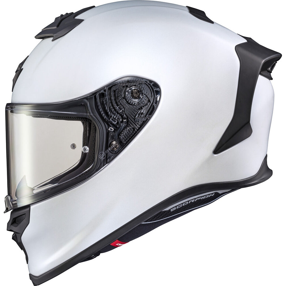 White motorcycle helmet with a clear visor on a white background