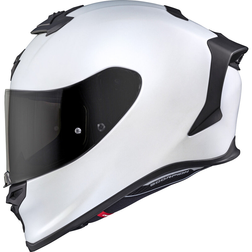 White motorcycle helmet with black visor on a white background