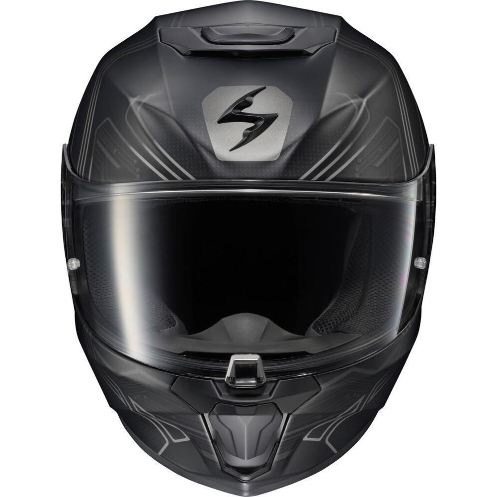 A full-face motorcycle helmet in matte black with subtle gray graphic accents and a clear visor, shown against a plain white background. The front features a stylized 'S' logo on a silver shield badge.