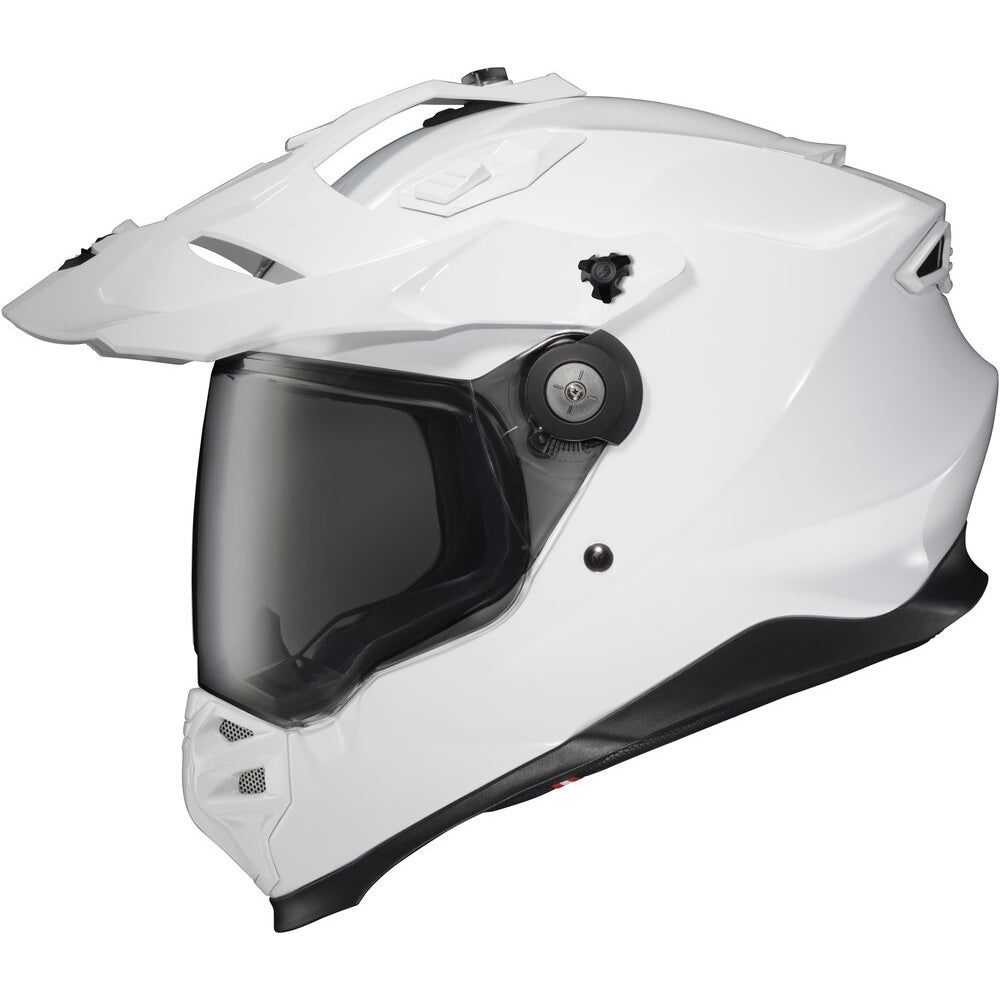 A white full-face Dual Sport motorcycle helmet with a dark tinted visor, featuring a chin guard and a side-mounted dial.