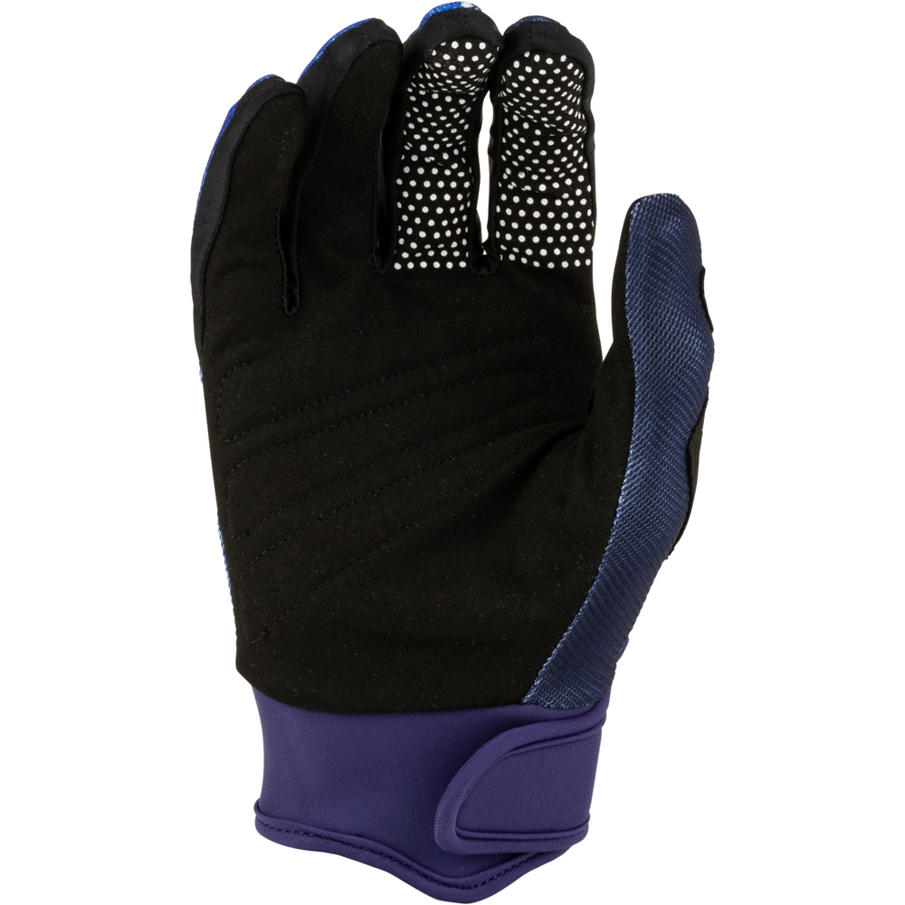 A single cycling glove shown from the back, featuring a black suede-like backhand with white micro-stripe grip dots on the fingers, a dark blue textured thumb side, and a purple adjustable wrist cuff.
