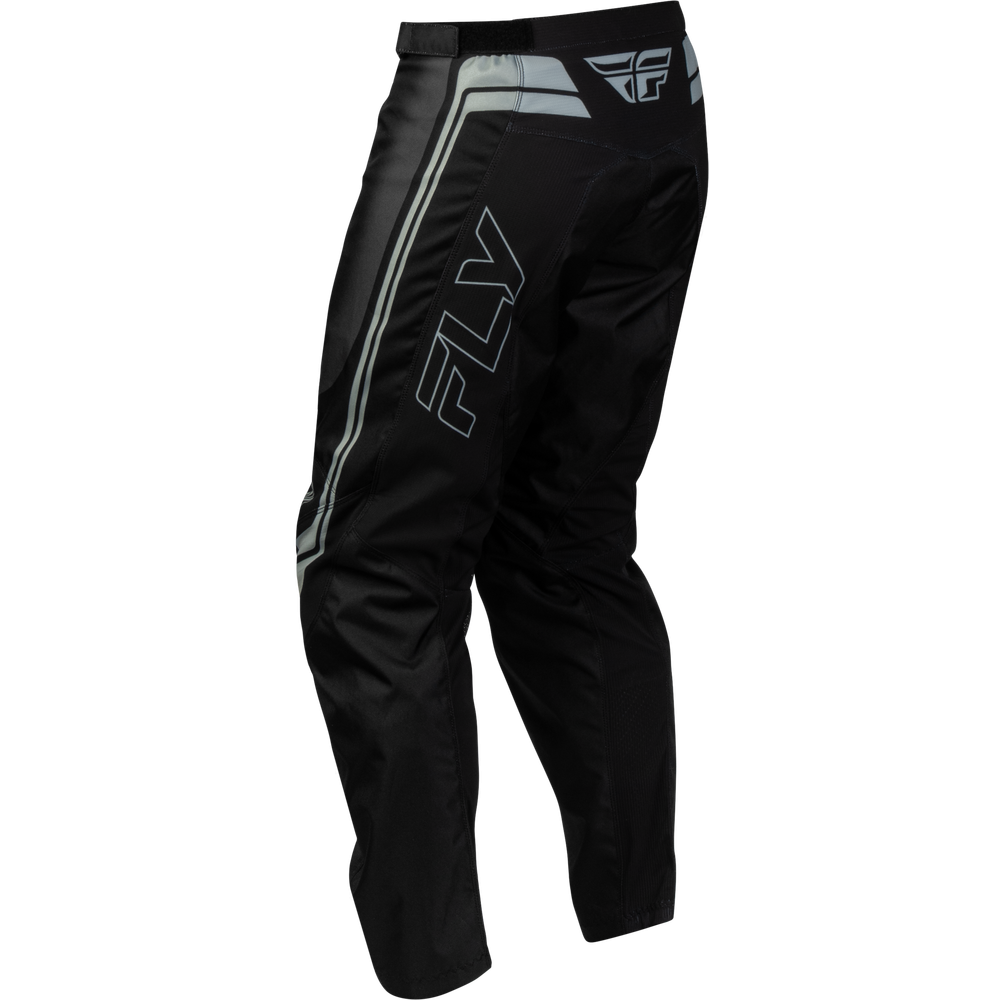 Black Fly Racing motocross pants with silver and white stripe details and a large outlined 'FLY' logo on the side, shown against a plain white background.