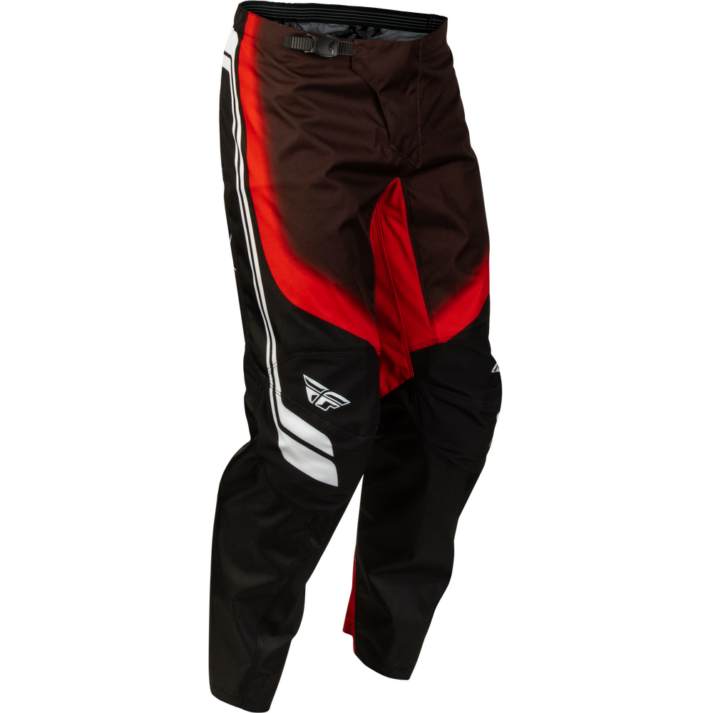 Black and brown motocross pants with red and white graphic accents, featuring a white stylized wing logo on the lower left leg.