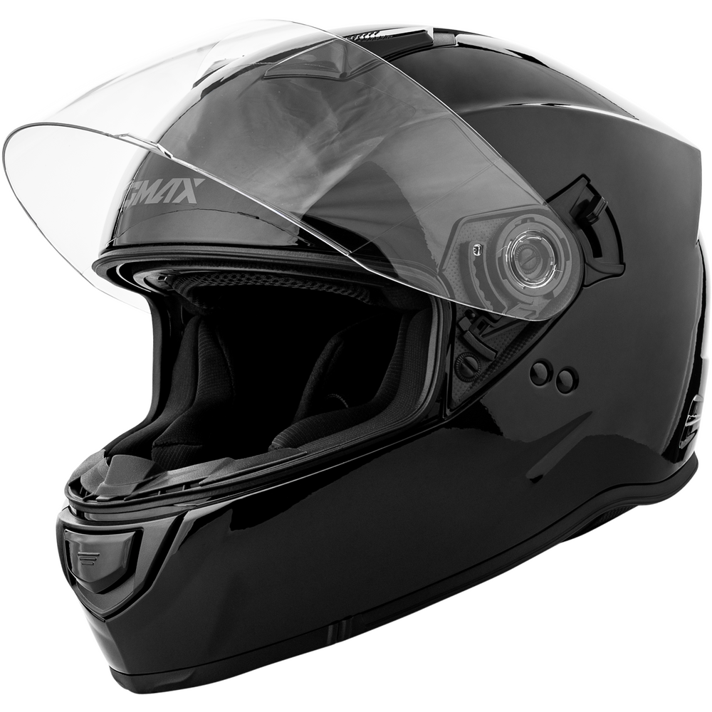 A glossy black full-face motorcycle helmet with a clear flip-up visor, shown from a three-quarters angle on a white background. The brand name 'SCMAX' is visible on the side of the visor.