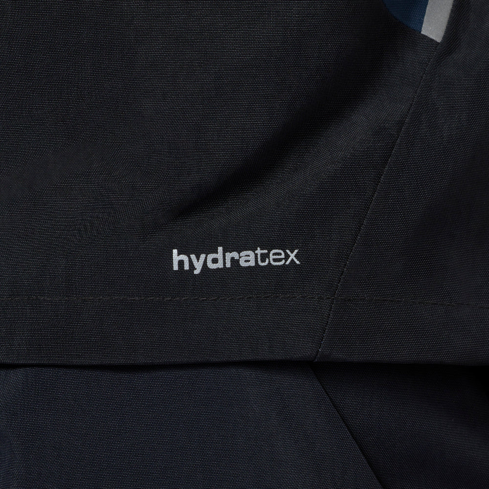 Close-up of a dark navy waterproof jacket showing the 'hydraTex' logo embroidered on the chest.