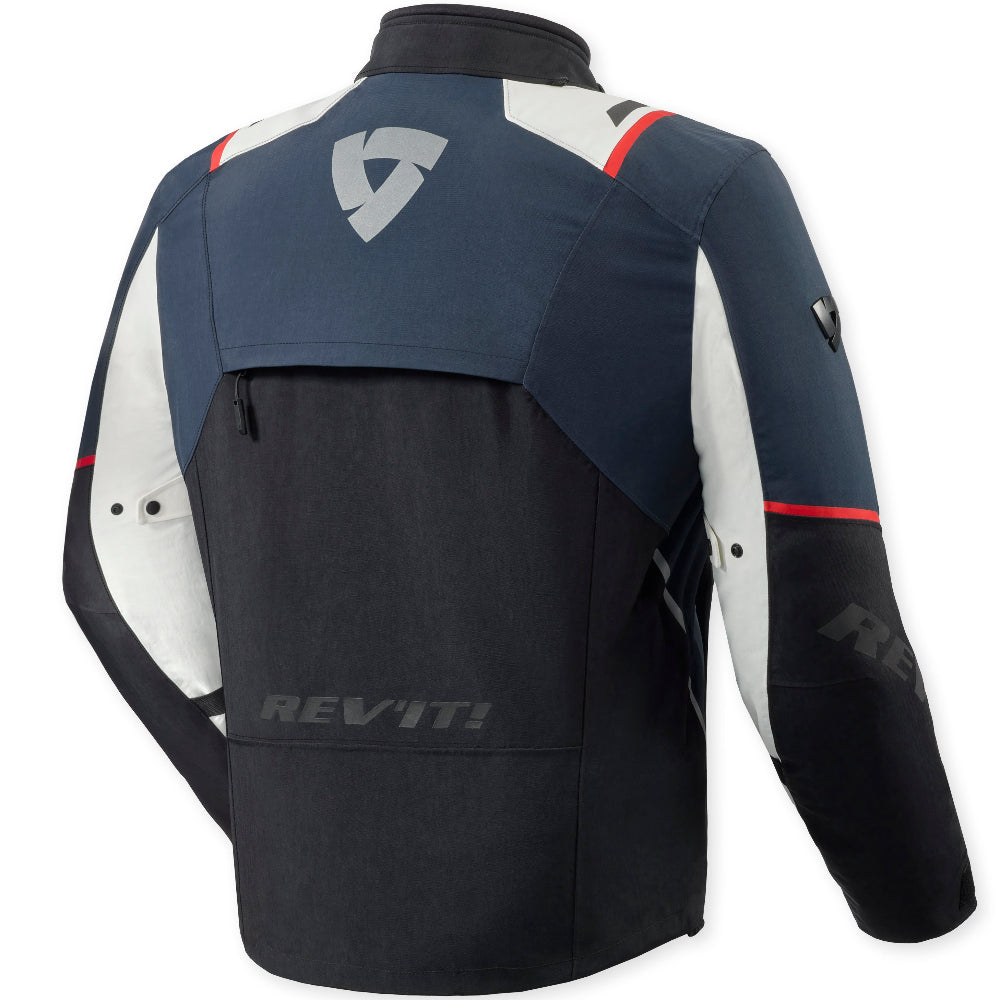 A REV'ITI motorcycle jacket shown from the back, featuring a navy blue upper back and shoulders, a black lower body, white side panels, and small red accent lines.