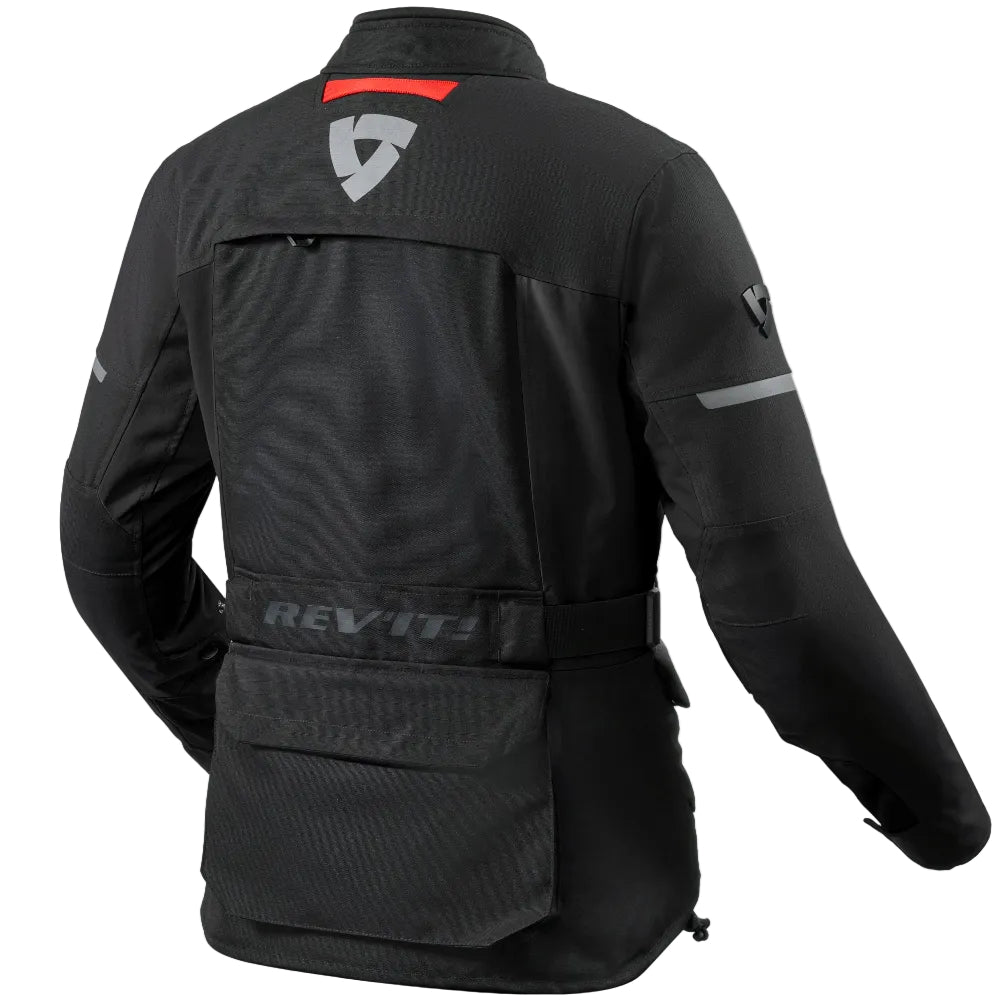 Black REV'IT! motorcycle jacket shown from the back, featuring a red accent stripe on the upper back, a gray REV'IT! shield logo, and a gray logo on the sleeve, set against a plain white background.