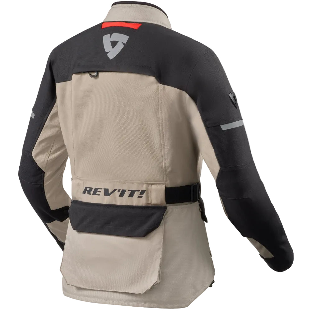 A beige and black motorcycle jacket shown from the back, featuring a large REV-IT! logo on the back pocket and a gray shield logo on the upper back, set against a plain white background.