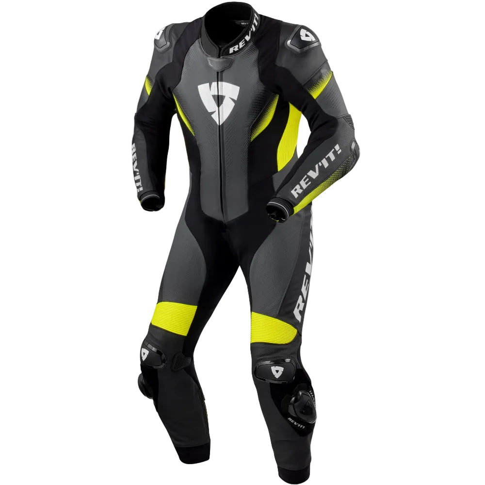 A REV'IT! full-face motorcycle racing suit in black and dark gray with bright neon yellow accents and white branding, displayed on a clean white background.