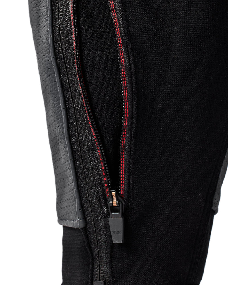 Close-up of a black jacket with a zipper on a light gray background