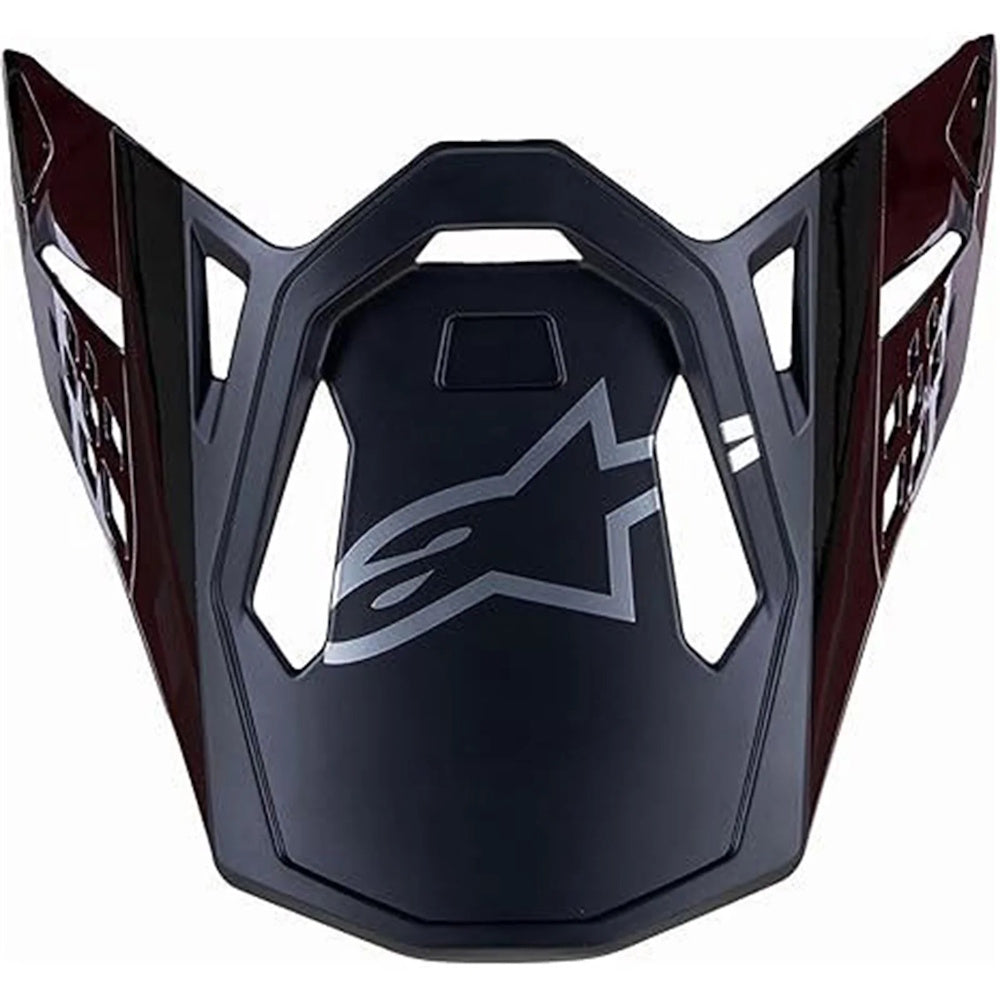 Black motorcycle helmet visor with a star logo on a white background