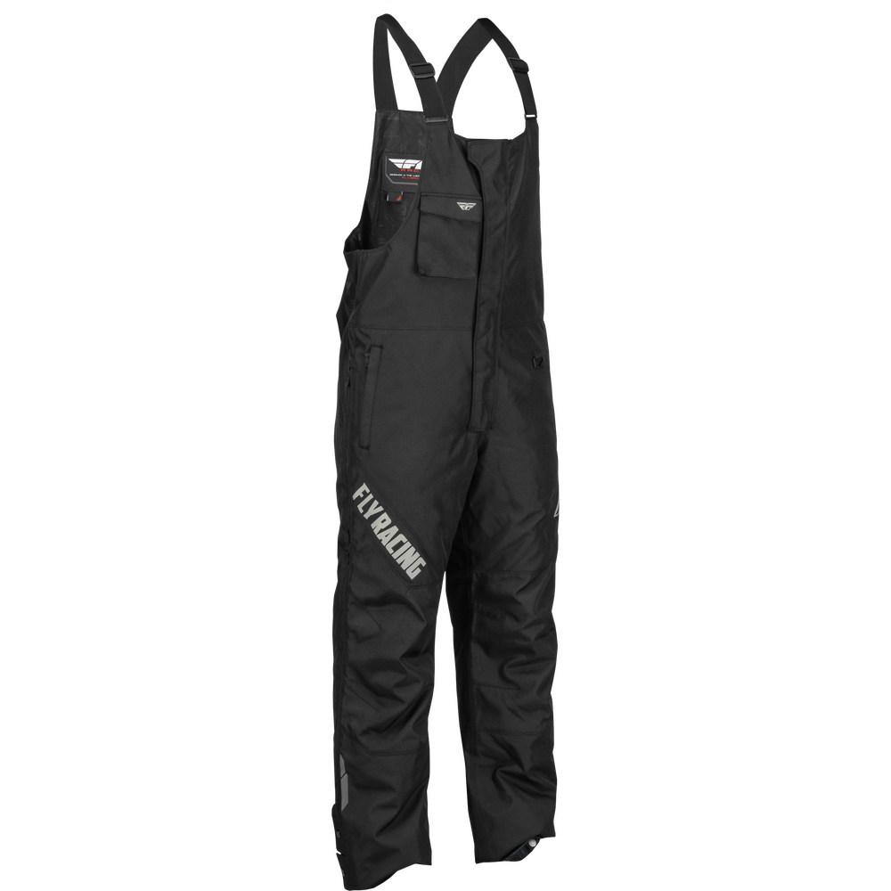 Black Fly Racing bib overalls with adjustable shoulder straps, multiple zippered pockets, and white 'FLY RACING' text printed on the left leg, shown against a plain white background.