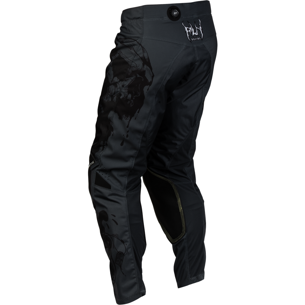 Black motocross pants with a dark distressed graphic on the left thigh and a white 'FLY' brand logo on the upper right hip, shown against a plain white background.