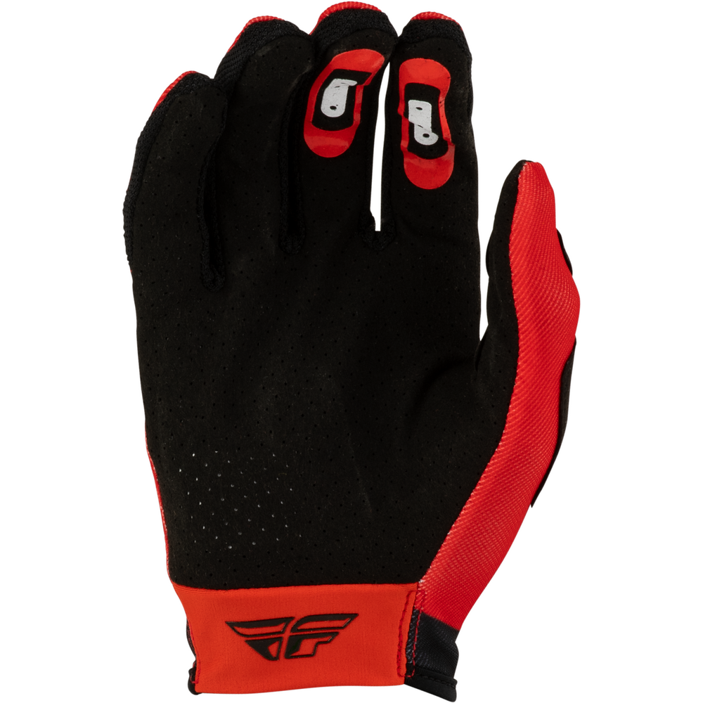 A single motocross or cycling glove shown from the back, featuring a black textured palm with red accents on the sides, fingers, and wrist cuff. The Fly Racing logo is printed in black on the red cuff.