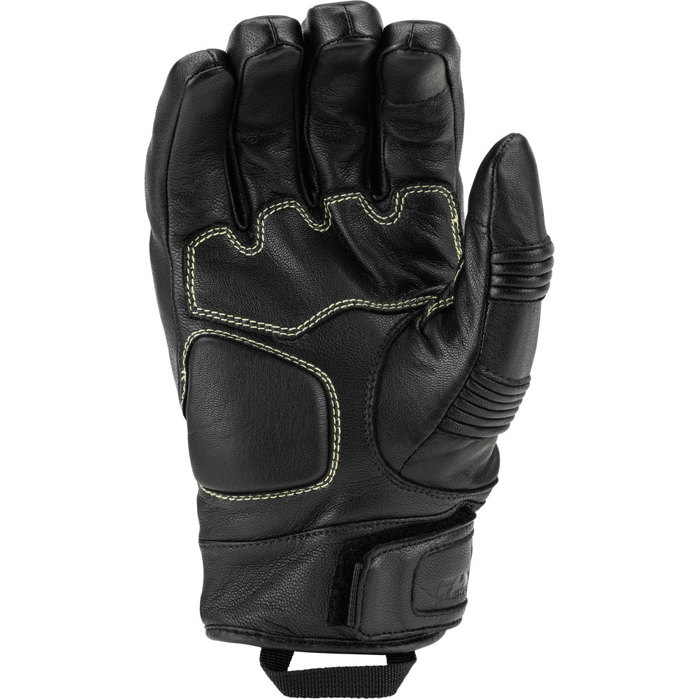 Black leather glove with textural details on a white background
