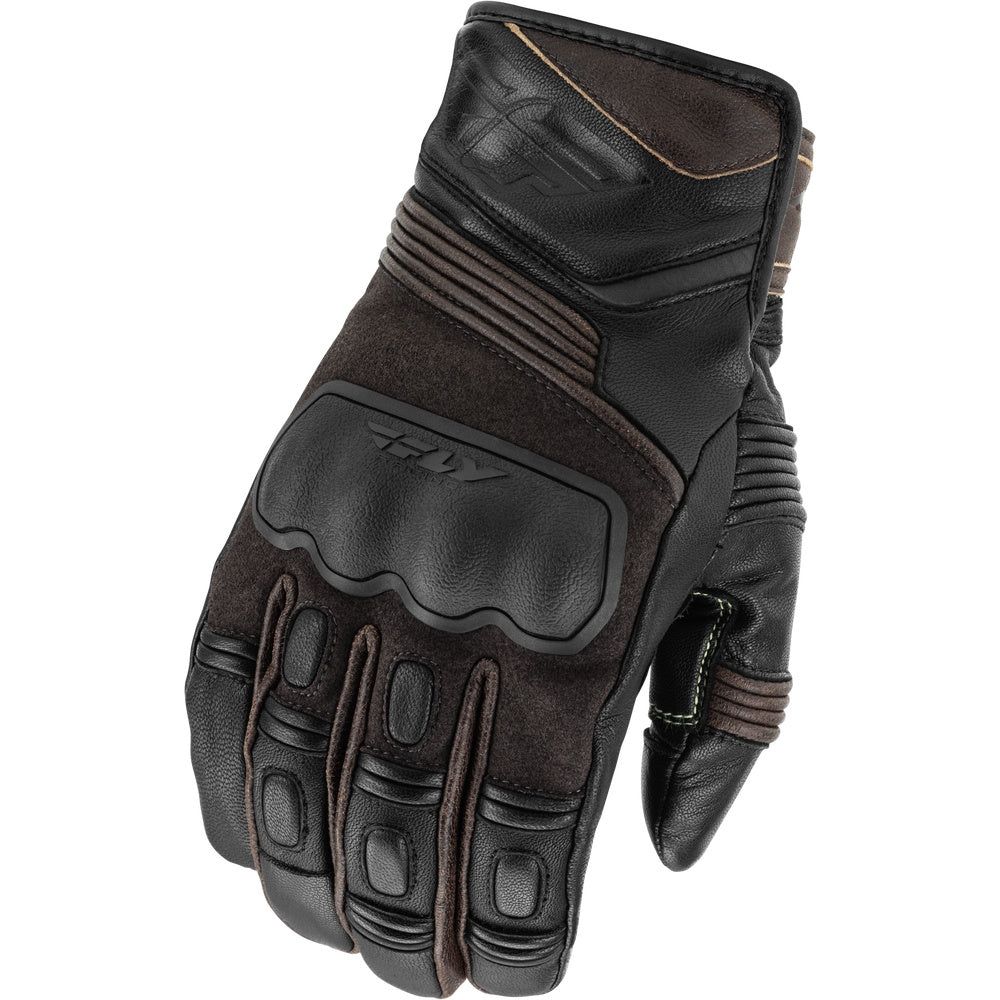 Black leather glove with brown accents on a white background
