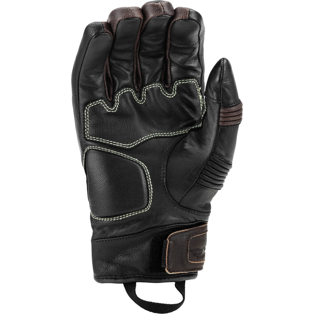 Black leather glove with brown accents on a white background