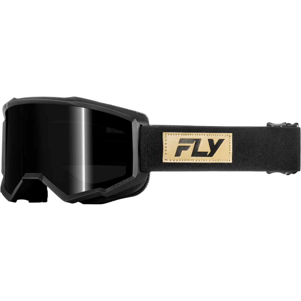 Black snow goggles with a black lens and a tan leather patch on the strap featuring the black 'FLY' logo, shown against a plain white background.