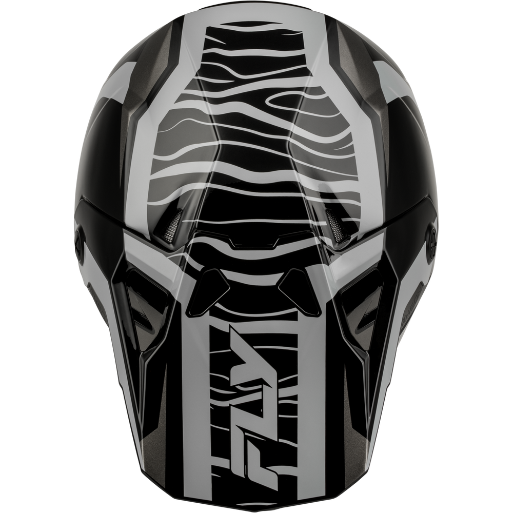 A close-up studio shot of a black and gray motocross helmet shell showing the front visor area with a bold wavy graphic pattern.