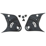Two black plastic components with screws on a white background