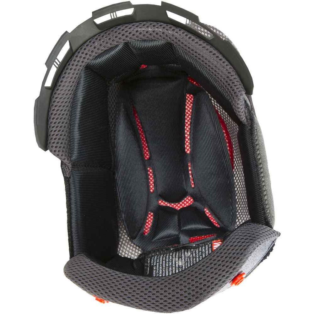 Close-up of a helmet interior with black padding and red stitching on a white background