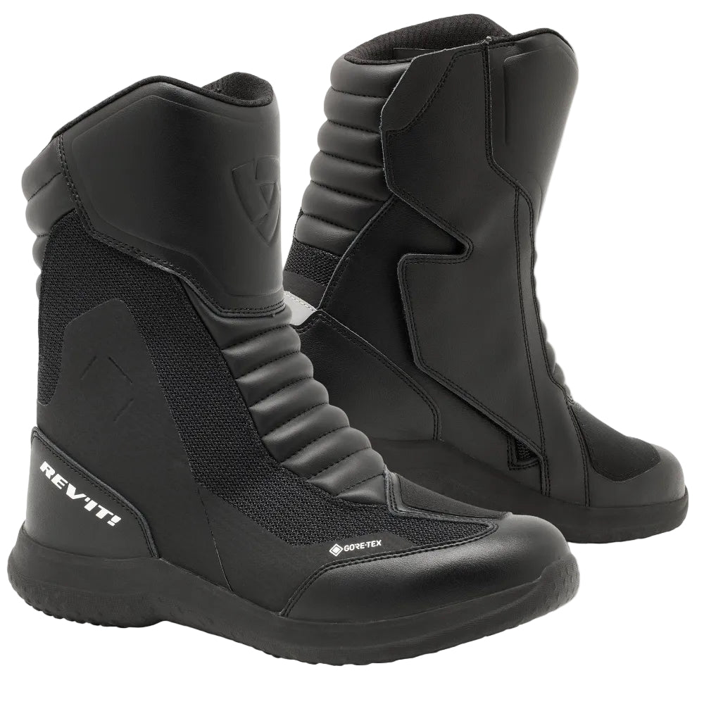 Black motorcycle boots with brand logo on a light gray background