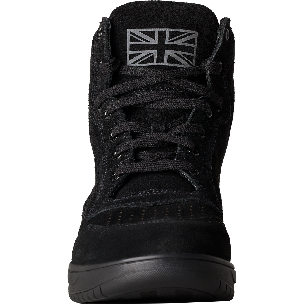 A black high-top sneaker boot with a black Union Jack flag patch on the tongue, shown from a front-facing perspective against a white background.