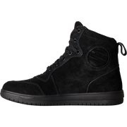 A black high-top sneaker made of suede and synthetic fabric, featuring lace-up closure, metal eyelets, a circular decorative patch on the side, and a thick black sole, shown against a plain white background.