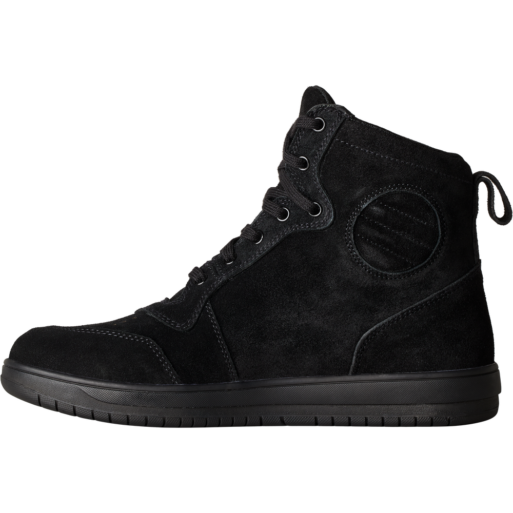 A black high-top sneaker made of suede and synthetic fabric, featuring lace-up closure, metal eyelets, a circular decorative patch on the side, and a thick black sole, shown against a plain white background.