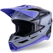 A full-face motocross helmet in a gray, white, and purple colorway, featuring a visor and a black interior, shown on a clean white background.