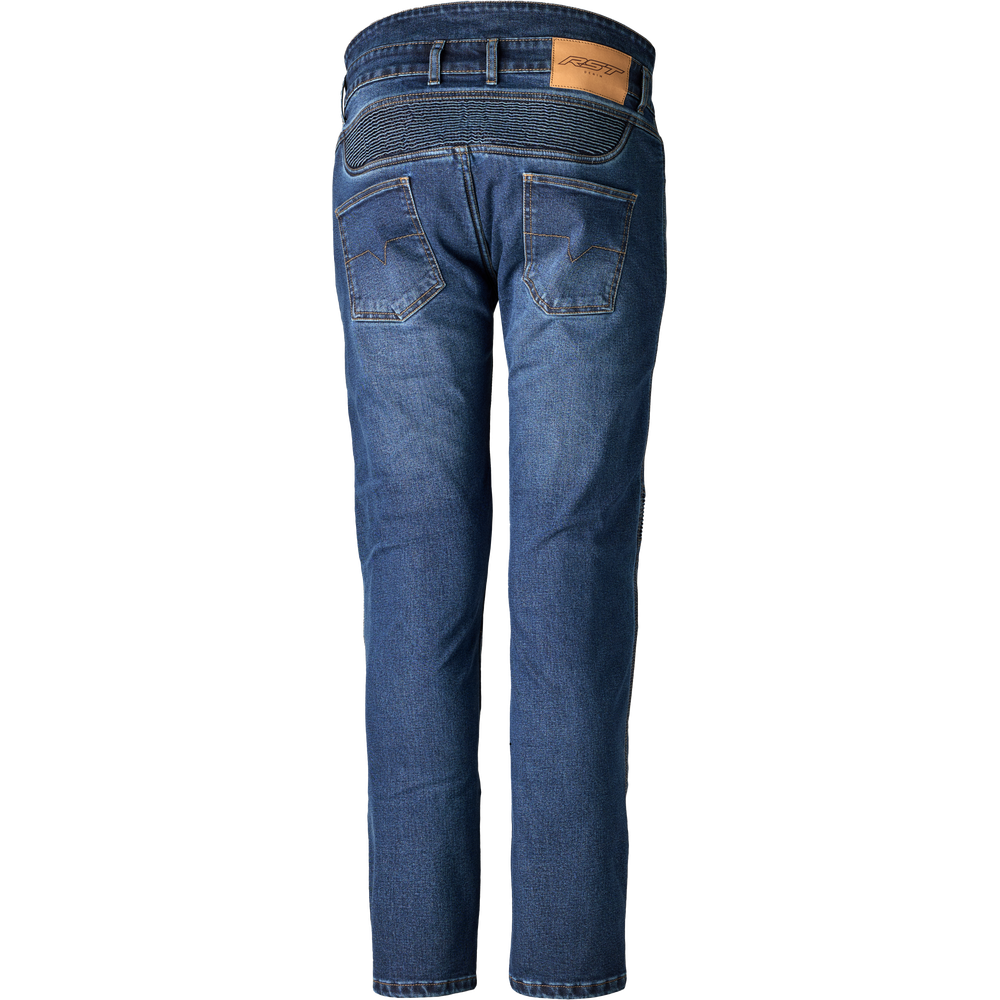 Back view of a pair of blue denim jeans on a white background, showing the back pockets, waistband, and a small tan leather brand patch.