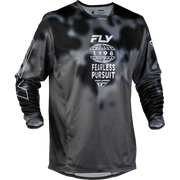 A long-sleeve motocross jersey in black and dark gray with a subtle mottled pattern, featuring a white graphic on the chest that reads 'FLY 1998 FEARLESS PURSUIT'.