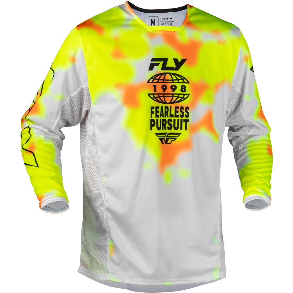 A long-sleeve athletic jersey with a white base and a neon yellow, orange, and green tie-dye pattern. The front features a black graphic print with the text 'FLY 1998 FEARLESS PURSUIT' and a globe logo.