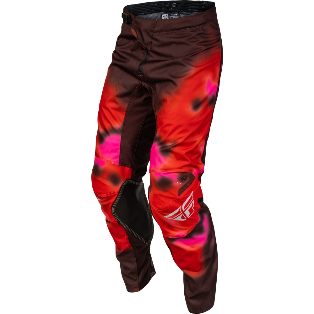 Red and black motocross pants with a vibrant pink and red tie-dye pattern, featuring black knee pads and a white Fly Racing logo on the lower leg.
