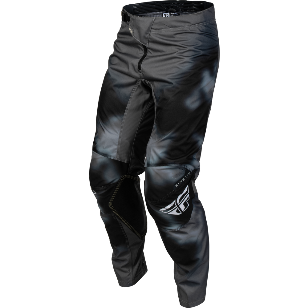 Black and gray motocross pants with a glossy finish, featuring a white wing logo on the lower left leg and a zippered front pocket.
