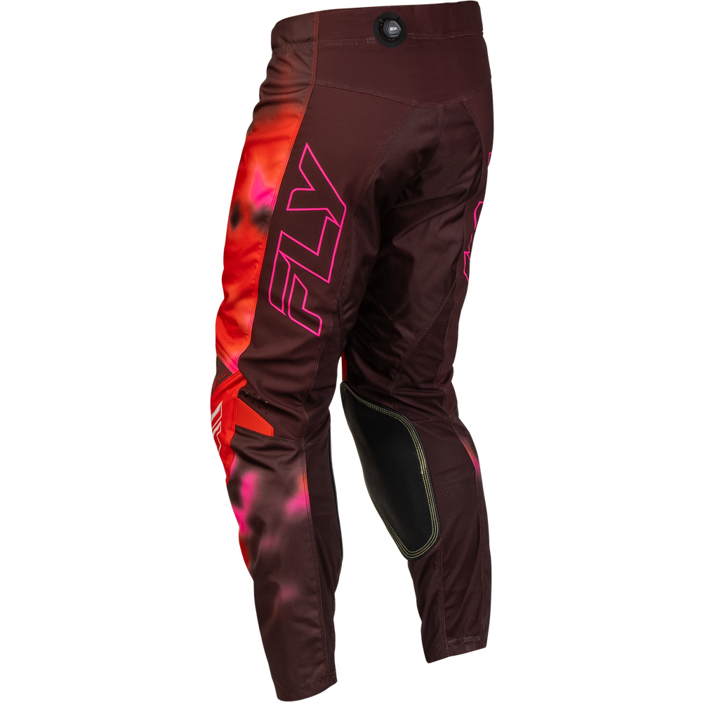 A pair of Fly motocross pants in dark brown with a vibrant red and pink flame graphic on the side and a large pink outlined 'FLY' logo, shown against a plain white background.