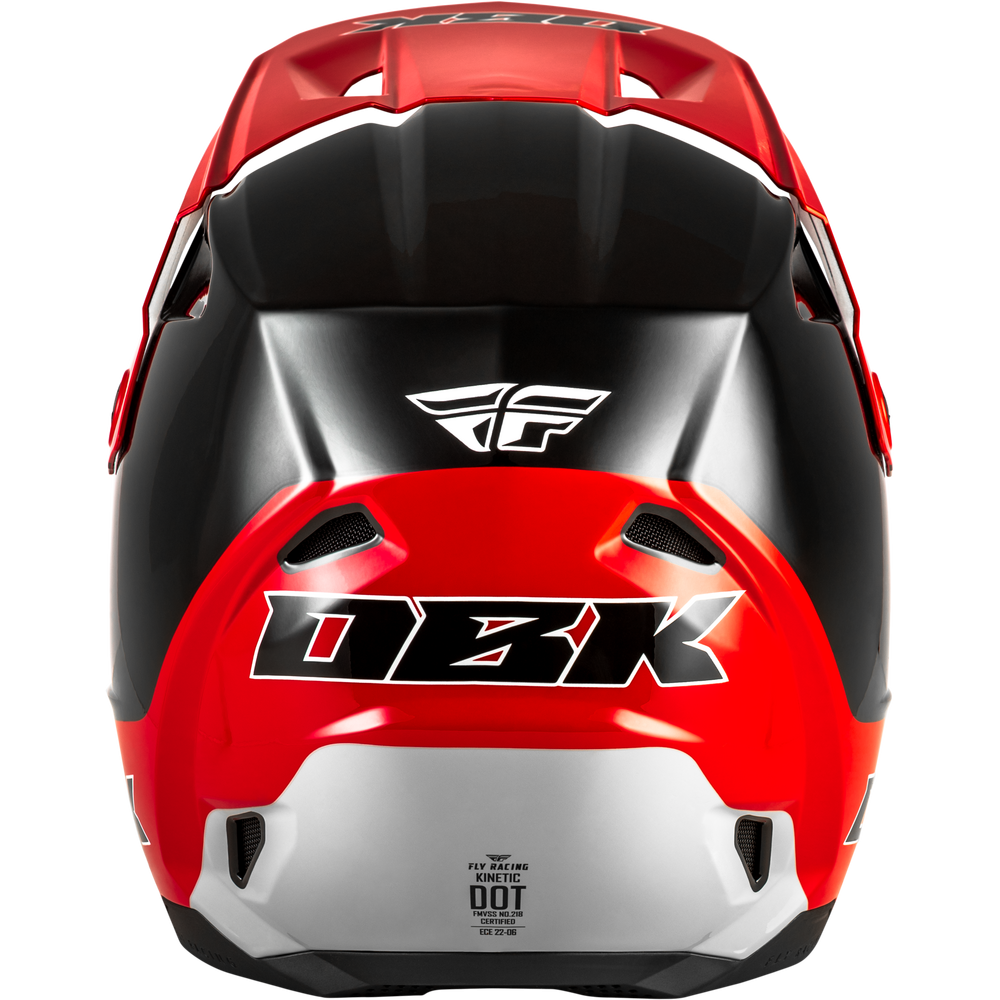 A red and black full-face motocross helmet with a silver lower section, featuring the DBK logo on the front and a white Fly Racing logo on the forehead, shown against a plain white background.