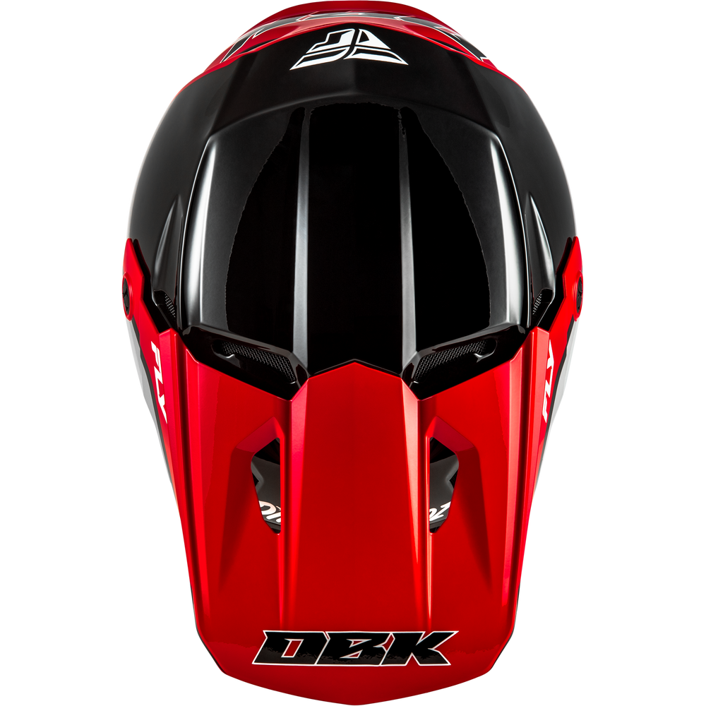 A red and black full-face motocross helmet with a clear visor, featuring the DBK logo on the front and side graphics, set against a plain white background.