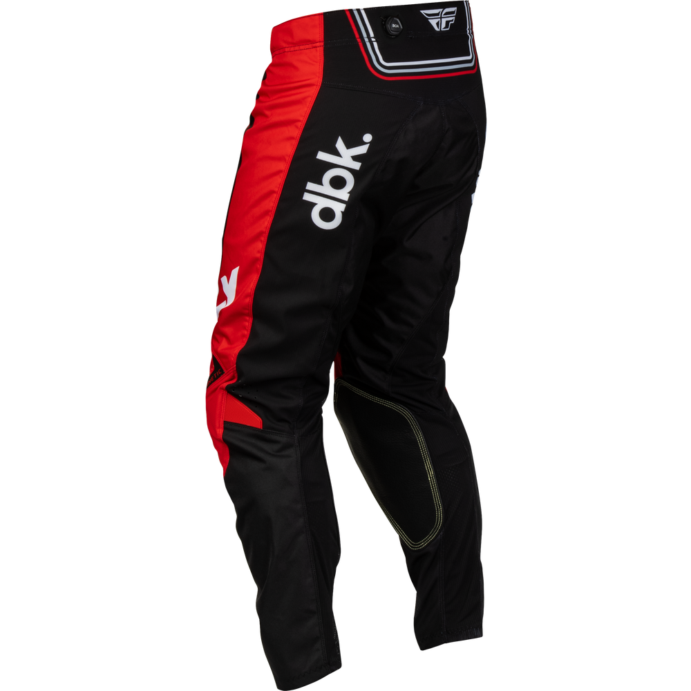 Black and red motocross pants with white 'dbk.' branding on the side, shown on a plain white background.
