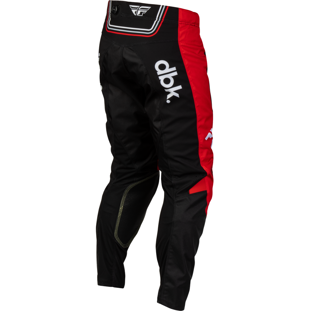 Black and red motocross pants with white 'dlk' branding on the left thigh and a white wing logo on the waistband, shown against a plain white background.