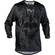 A black long-sleeve athletic jersey with a large dark gray and black skull graphic on the front, featuring a dripping design and the 'FLY RACING' logo above it, shown against a plain white background.