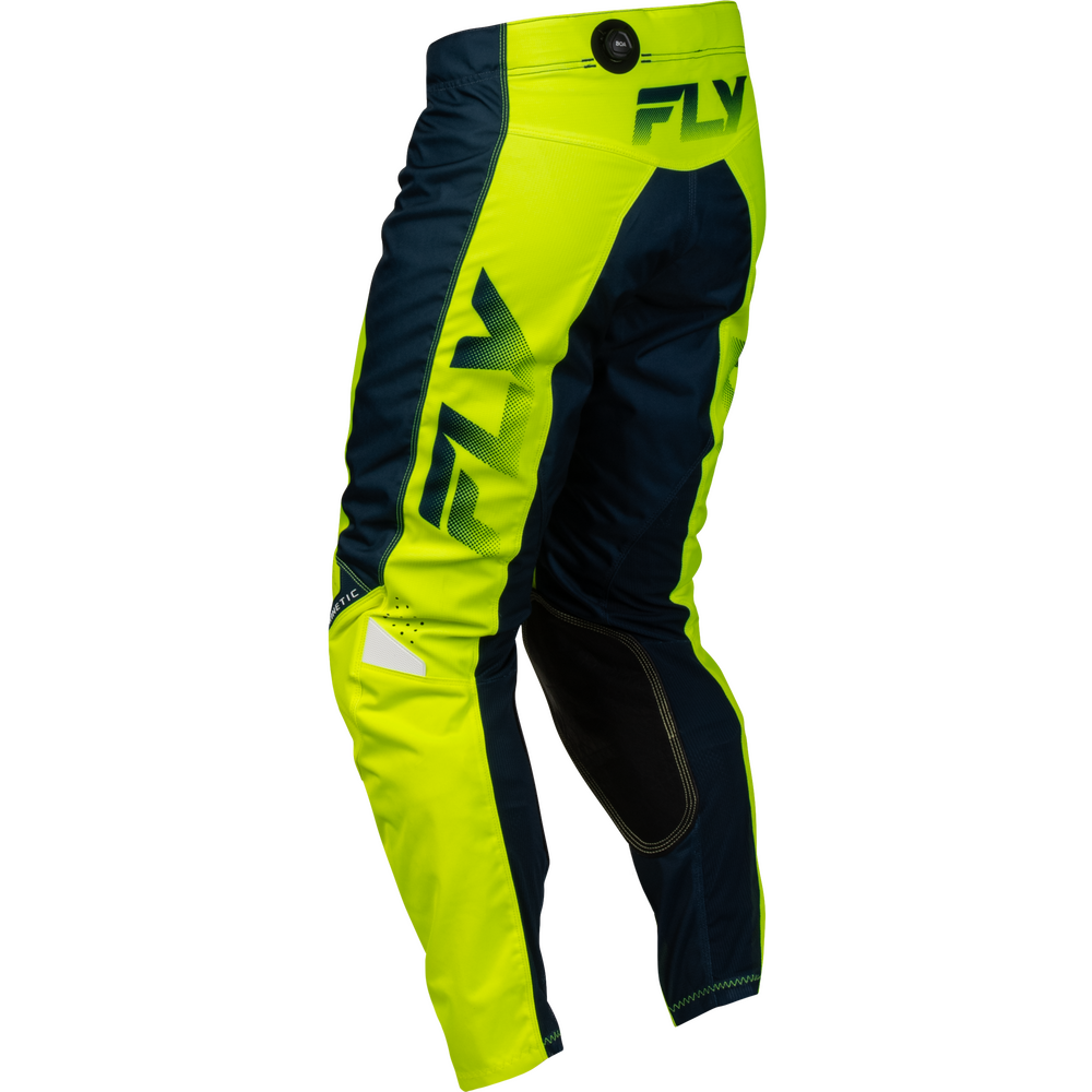 Neon yellow motocross pants with dark navy panels and black knee pads, featuring a large green 'FLY' logo on the thigh and waistband.