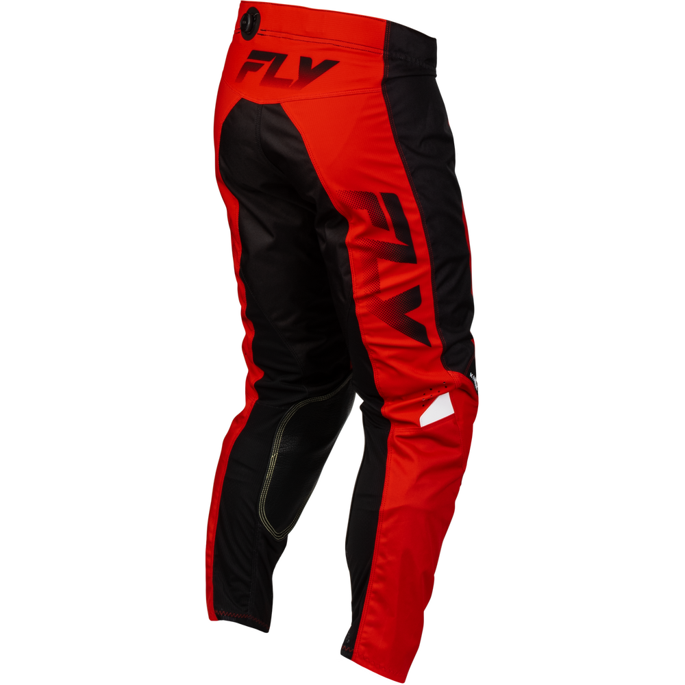 Red and black Fly motocross pants with large black Fly logos on the side and waist, shown on a plain white background.