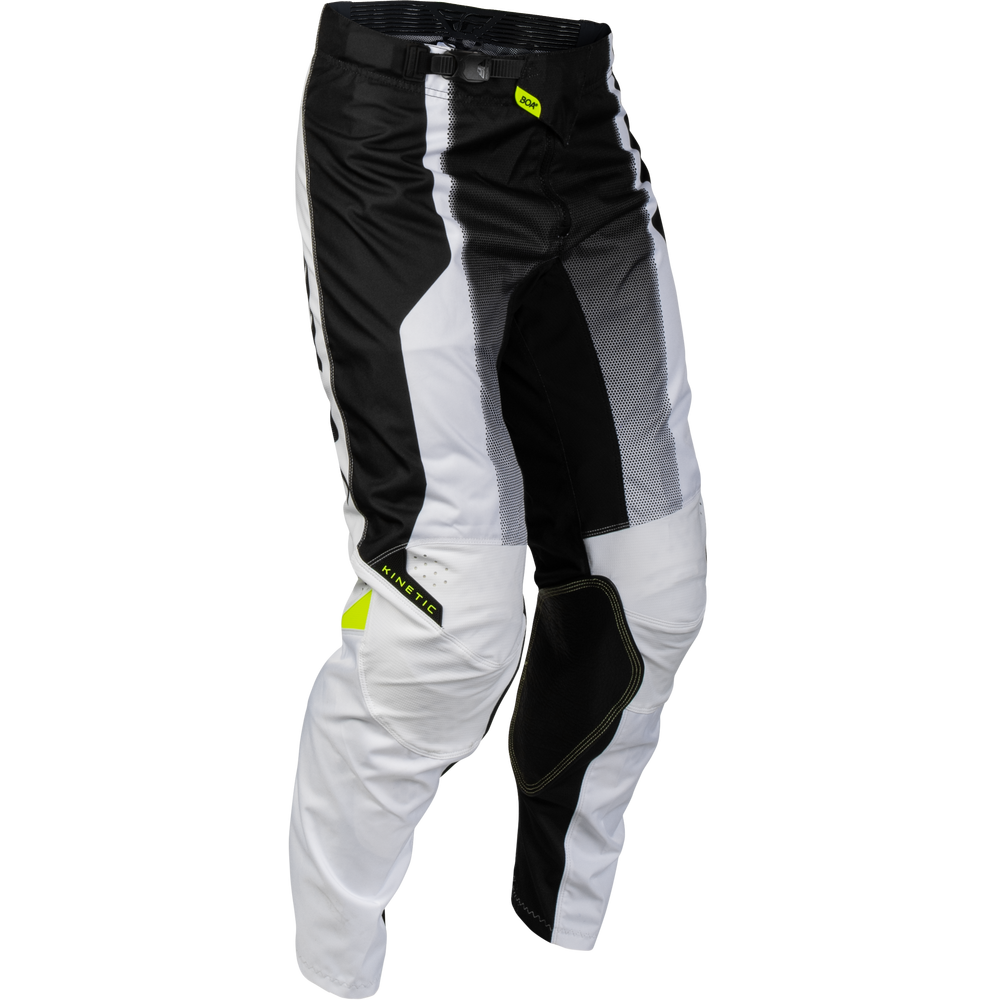 Black and white motocross pants with protective knee pads and a small neon yellow logo, shown on a plain white background.
