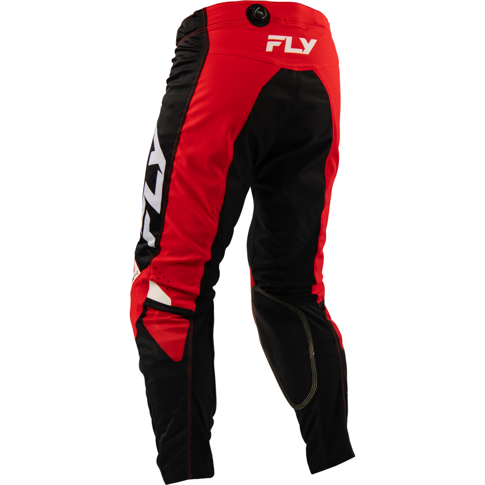 Red and black motocross pants with white FLY branding, shown from the back on a white background.