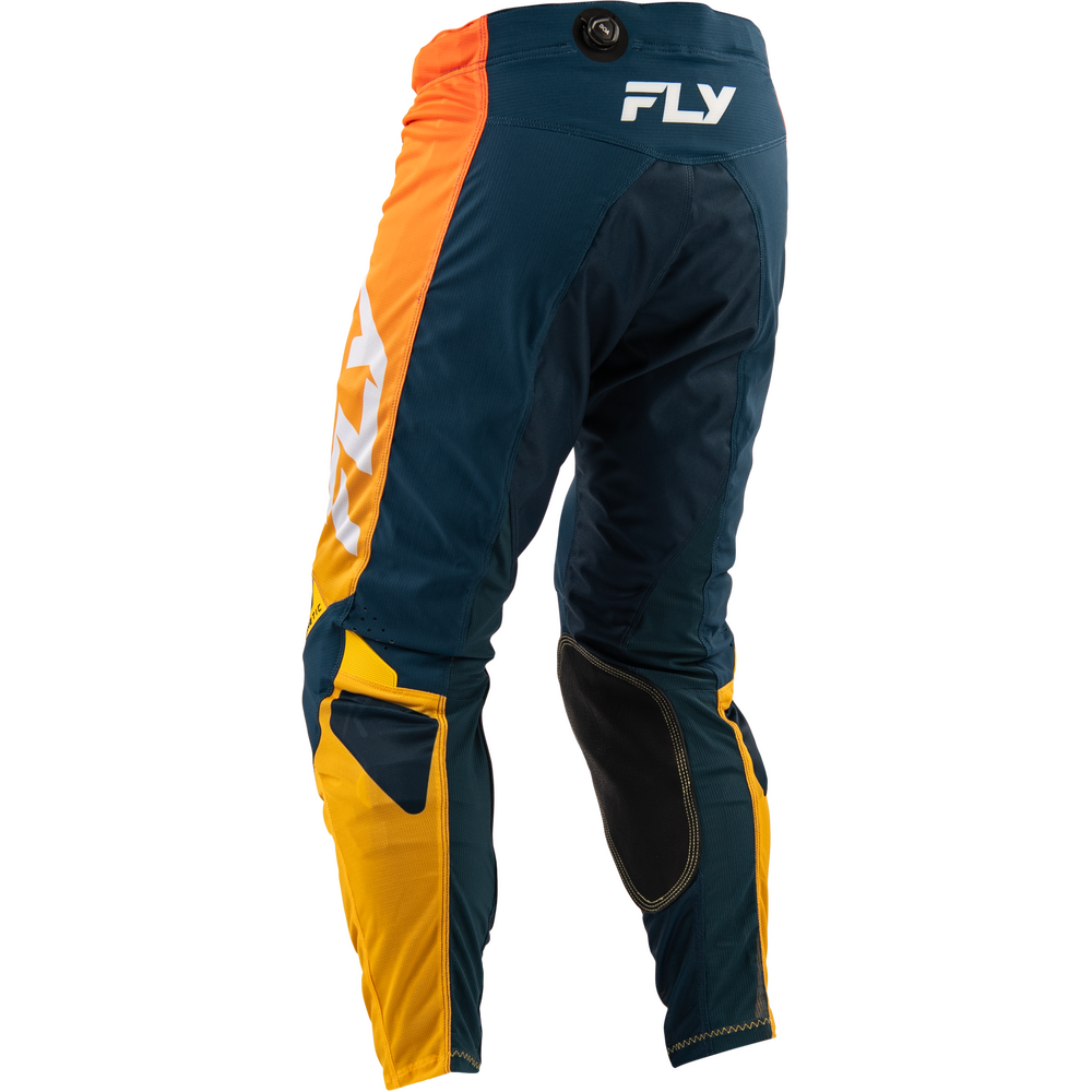 A pair of motocross pants shown from the back, featuring a dark teal blue base with bright orange side panels, yellow lower leg sections, and black knee pads. The brand name 'FLY' is printed in white on the upper back.