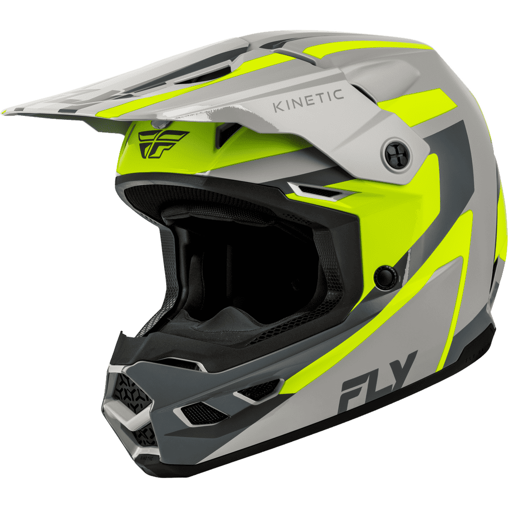 A Fly Racing Kinetix motocross helmet in a striking gray and neon yellow colorway, featuring a full-face design with a visor and black interior padding, shown on a plain white background.