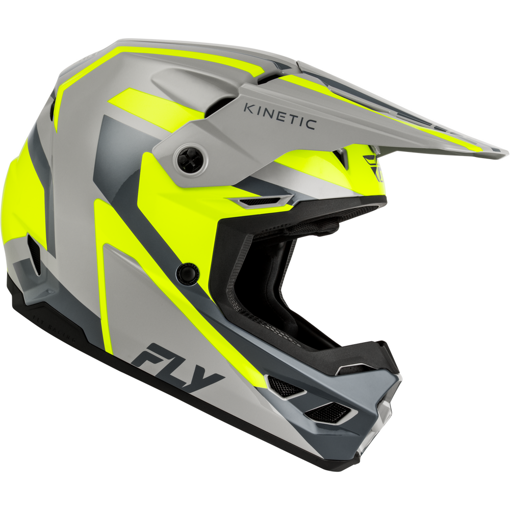 A motocross helmet by Fly Kinetic in a gray and neon yellow colorway, featuring a full-face design with a visor and visible brand logos.