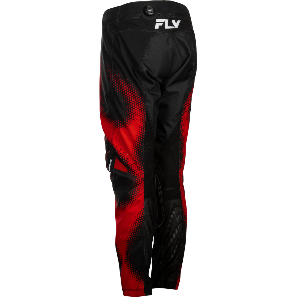 Black and red motocross pants with a red halftone gradient pattern and a white 'FLY' logo on the upper right hip, shown against a plain white background.