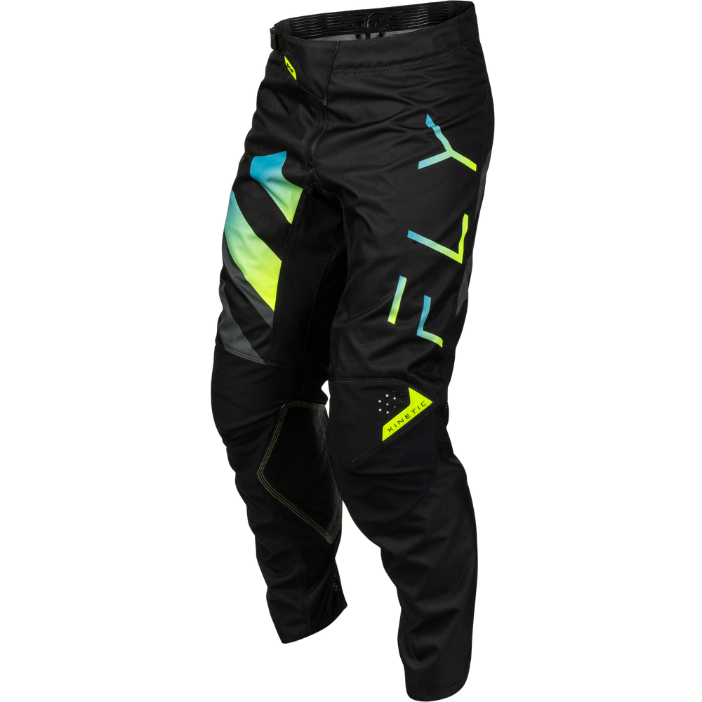 Black motocross pants with neon yellow, green, and blue geometric graphics, shown on a white background.